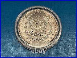 1885o 1oz Silver Morgan Dollar. In Capsule