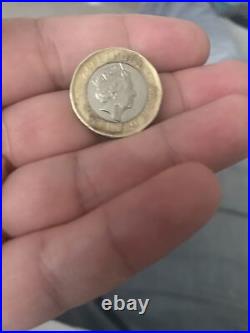 Black 1 pound coin print error